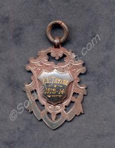 Unidentified badge dated 1913-1914 and marked F.E.