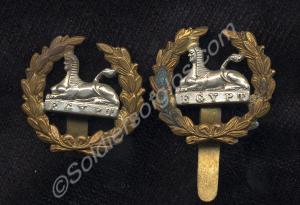 Two large Back Badges with a silver sphinx and bra