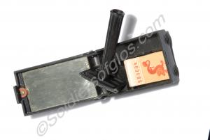 Razor and black Bakelite container with mirror and