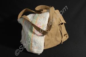Khaki cotton holdall with white lining and strap,