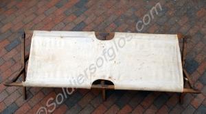 Officer's camp bed. White canvas with wooden legs