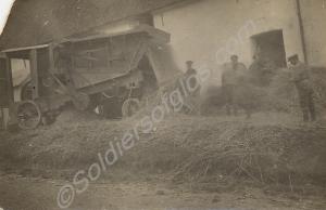 Soldiers with a threshing machine.  1/4th Battalio