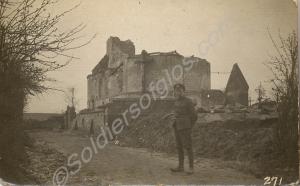 Soldier standing by a ruined church.  1/4th Battal