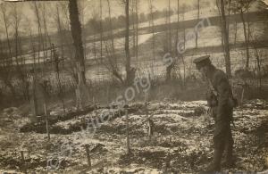Soldier in a cemetery with a light covering of sno