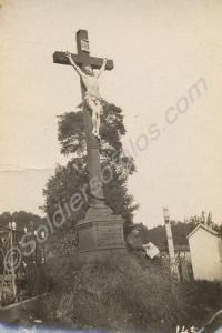 Soldier reading newspaper by roadside calvary. 1/4