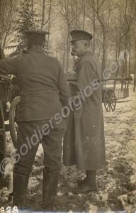 Two soldiers standing by wagon in snow. 1/4th Batt