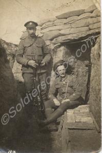 Corporal and Warrant Officer outside dugout in a t