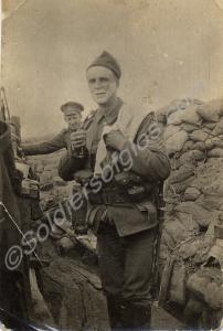 Sergeant wearing knitted woollen cap shaving in a