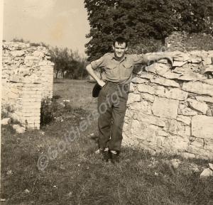 Soldier by dry stone wall. Gloucestershire Regimen