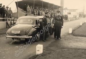 Duke of Gloucester stepping out of a Mercedes.  Gl