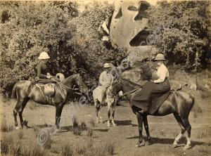 Mounted party of three on expedition at the foot o