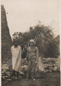 Soldier and villager outside a temple. 1st Battali