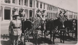 Parade of mule-drawn gharries. Reverse 'A.T. Cush