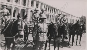 Parade of mule-drawn gharries. Reverse 'A.T. Cush