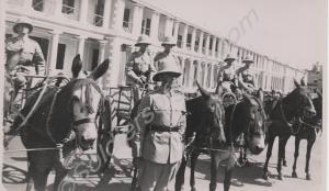 Parade of mule-drawn gharries. 1st Battalion, The
