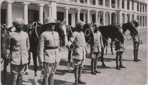 Horses being held by troops. 1st Battalion, The Gl