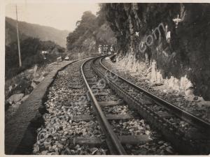 Railway with group of men standing on the track in