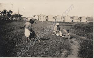 'Coolie woman working. Note the big sun hat'.  2nd