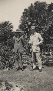 Two civilian men standing in garden. Reverse 'Henr