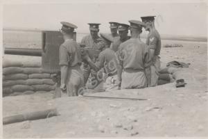 Manning a sandbagged gun emplacement.  2nd Battali