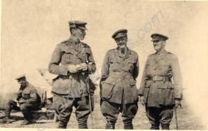 Three officers standing. Front '12th Batt. Parr, C