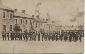 Parade of soldiers in full dress and wearing Home