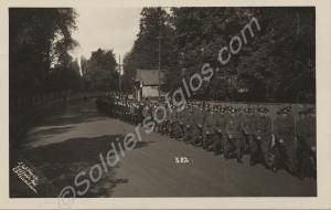 Soldiers marching, followed by new recruits. 1/5th
