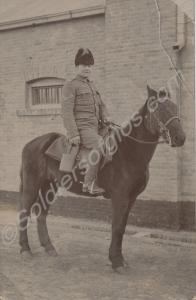 Corporal in fur-lined cap on horseback. 2nd Battal