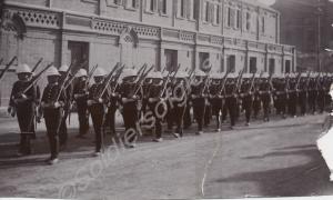 Soldiers marching, Wolseley solar topees, scarlet