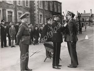 Colonel C.J. Stewart O.B.E. presenting the Territo