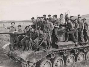 Soldiers riding a Comet tank. 5th (Territorial) Ba