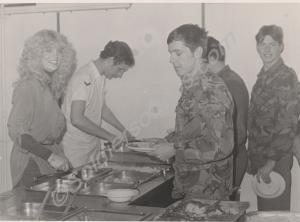 Beauty Queen "Miss Avon"  in cookhouse with Lance