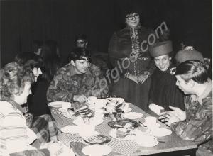 The Duchess of Gloucester taking tea with soldiers