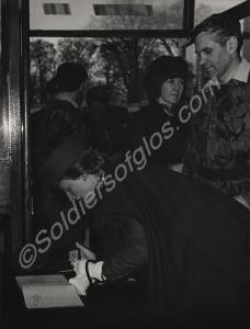 The Duchess of Gloucester signing the visitors' bo