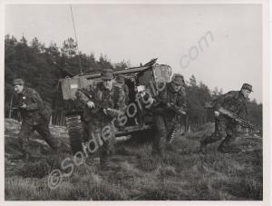 Exiting an armoured personnel carrier. 1st Battali