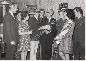 Mr. Smith presenting a cheque to Ray Peart, 1974.