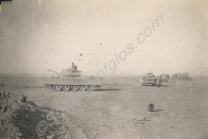 Crusader tanks with trucks in the desert.  Royal G