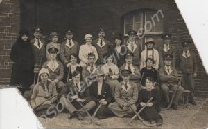 Soldiers with hockey sticks from various units in