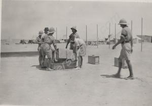 Watering the officers' tennis court. 2nd Battalion