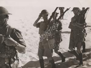 Soldiers of "D" Company advancing with shouldered