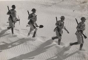 Patrol with entrenching tools crossing a dune.  2n