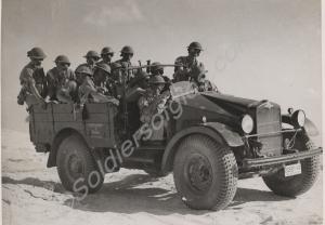 14 Platoon in gas masks crossing the desert in a M