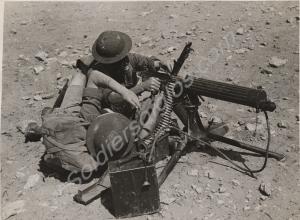 Soldiers in gas masks with Vickers machine gun.  2