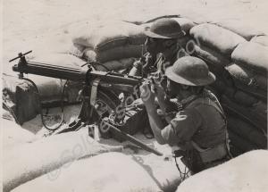 Soldiers in gas masks with Vickers machine gun in