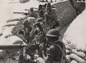 Soldiers with gas masks and Vickers machine gun in
