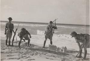 Soldiers playing at digging a trench at Water Poin