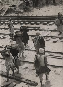Egyptian construction gang laying rail track betwe