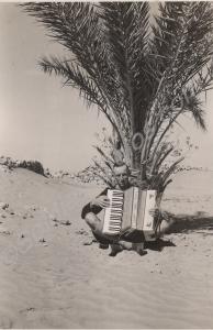 Padre Williamson with accordion. 2nd Battalion, Th