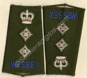 Pair of mint shoulder slides made for the Colonel