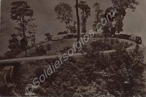 Steam train negotiating a hairpin loop climbing up